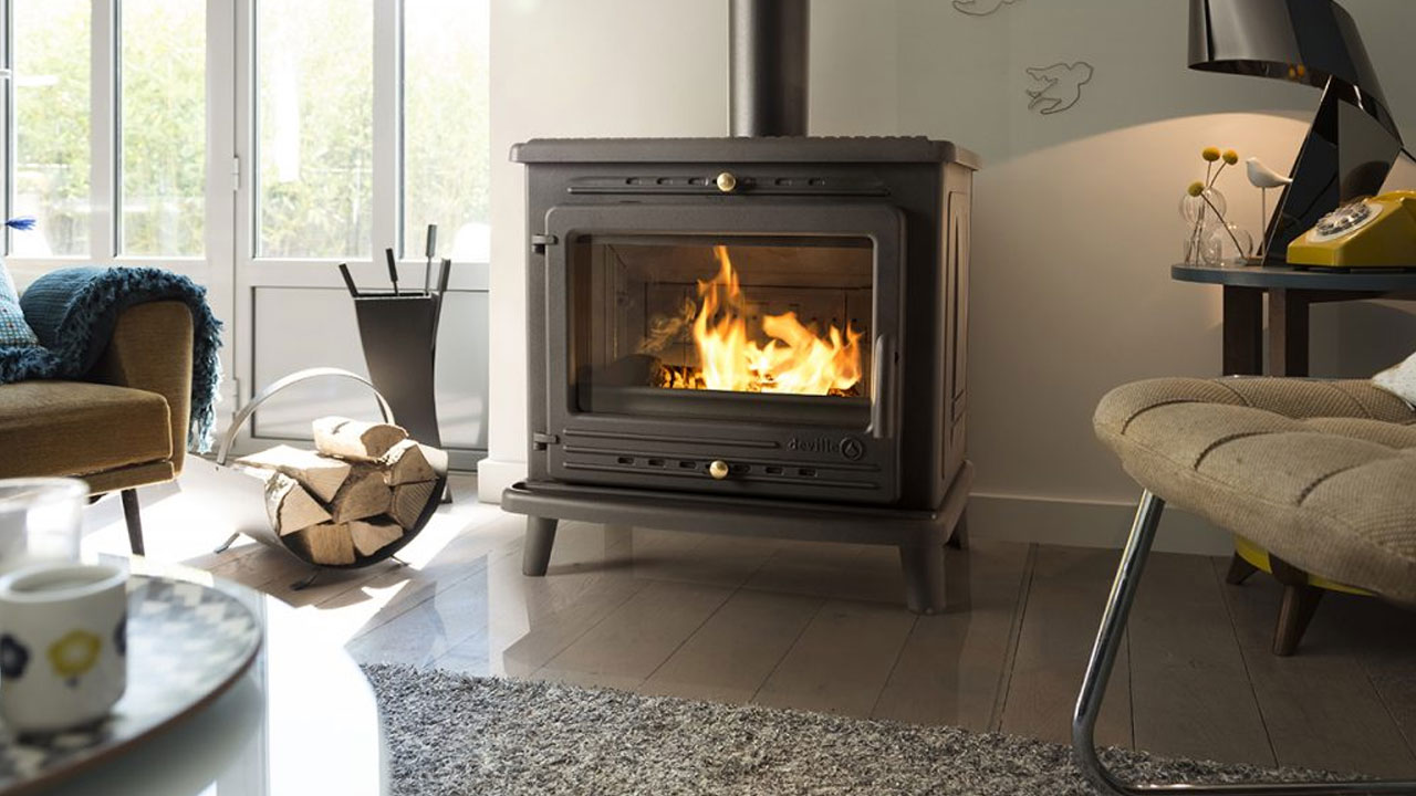 Wood stove heating a living room in Portugal with correct stove size for the space